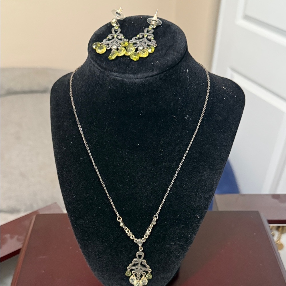 Silver and Yellow Pendant Necklaces with Ornate Designs